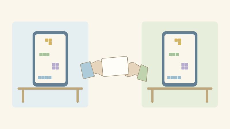 2つの部屋のスマホに同じ形のブロックが並び、中央で2本の手が1枚のメモを手渡ししている。